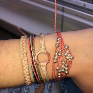 anchor, circle, and lotus bracelets